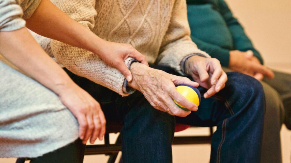 Caregiver providing in-home hygiene assistance to a senior, supporting safety, independence, and well-being.