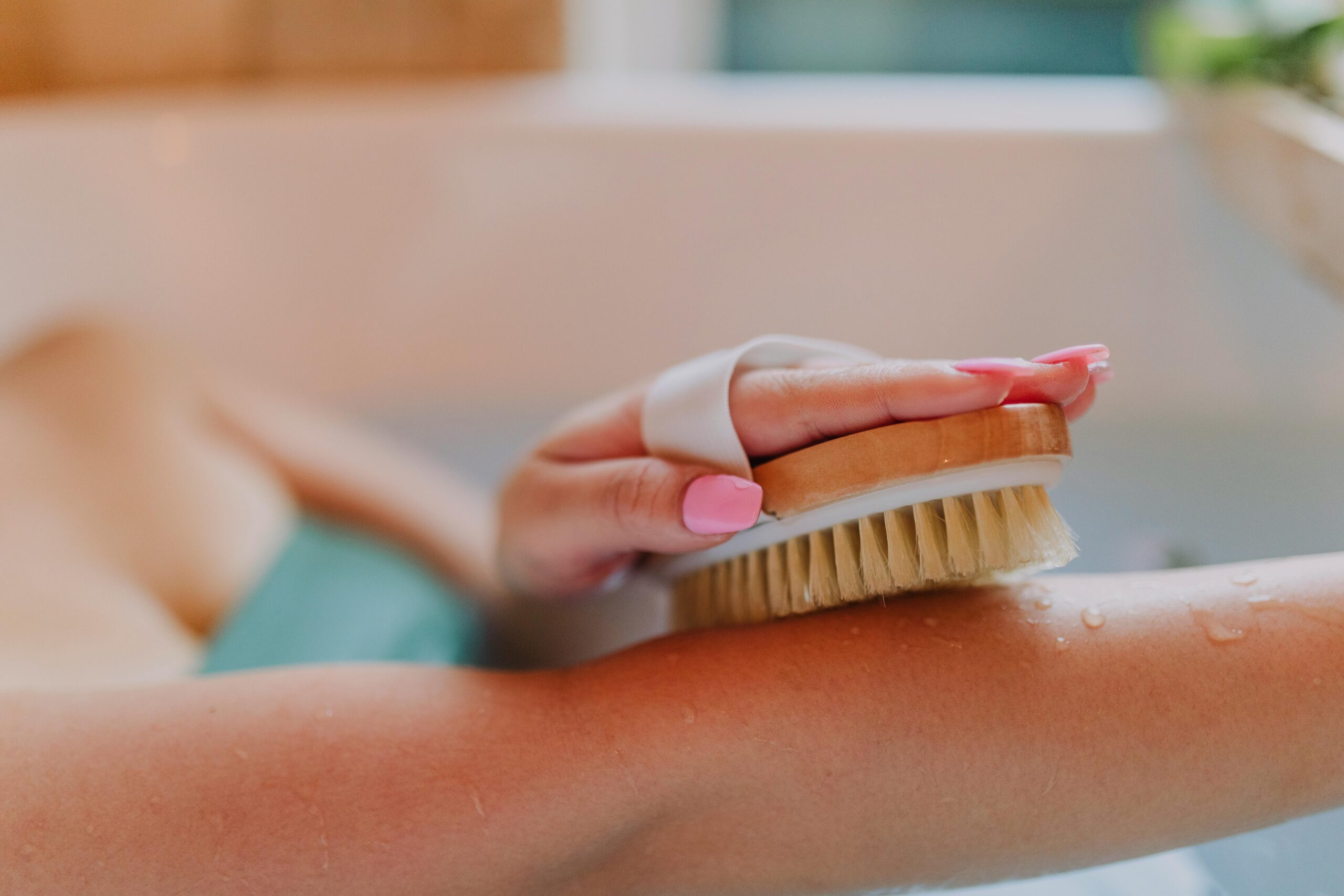 Senior practicing personal hygiene in a bathtub by using a brush to clean their arm, demonstrating how cleanliness fosters mental health and confidence in older adults, as highlighted in 'Personal Hygiene & Mental Health: How Feeling Clean Boosts Confidence in Seniors'. This keeps it descriptive, accessible, and SEO-friendly while reinforcing the connection between hygiene and well-being. Let me know if you’d like any refinements!